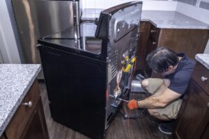 technician working on a oven