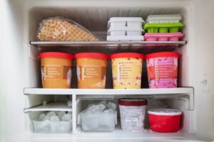 ice creams and ice cubes in freezer